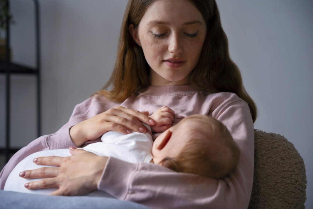 medium-shot-mother-with-cute-newborn-1392x928